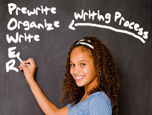 girl writing on chalkboard