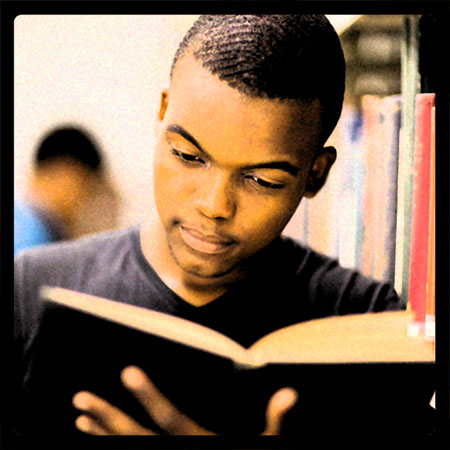 Student reading in the library