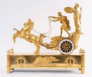 A 19th-century French clock depicting Telemachus driving a chariot and Athena riding on the back