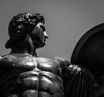 Statue of Hercules facing right and holding a shield