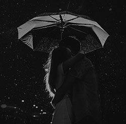 couple embracing under an umbrella