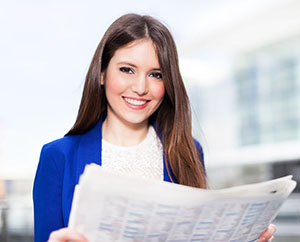 student reading a newspaper