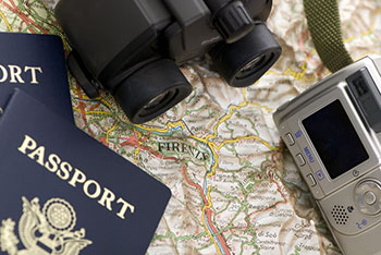 map with passport and camera