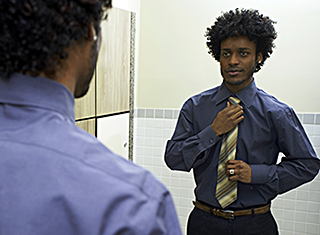 Young Man Looking in the Mirror