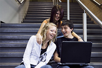 Students happy on computer