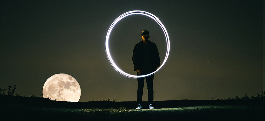 A teenager, the moon, and a glowing circle