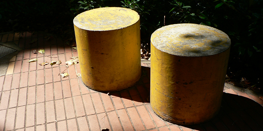 Two large yellow cylinders