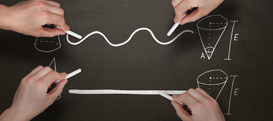 four hands drawing cone diagrams on a blackboard