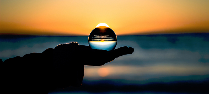 Holding a sphere in the sunset