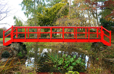 a pedestria bridge with hand rails