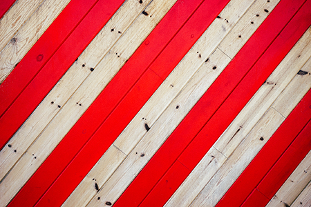 Wood running parallel with some boards highlights in bright red