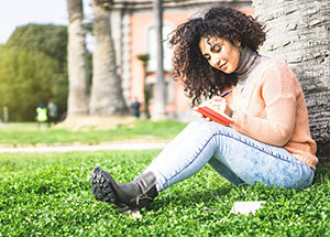 student writing in a notebook