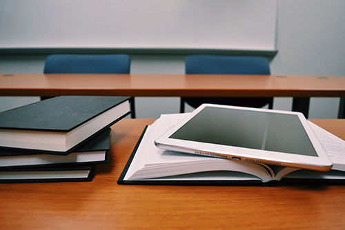 a tablet device resting on an open book