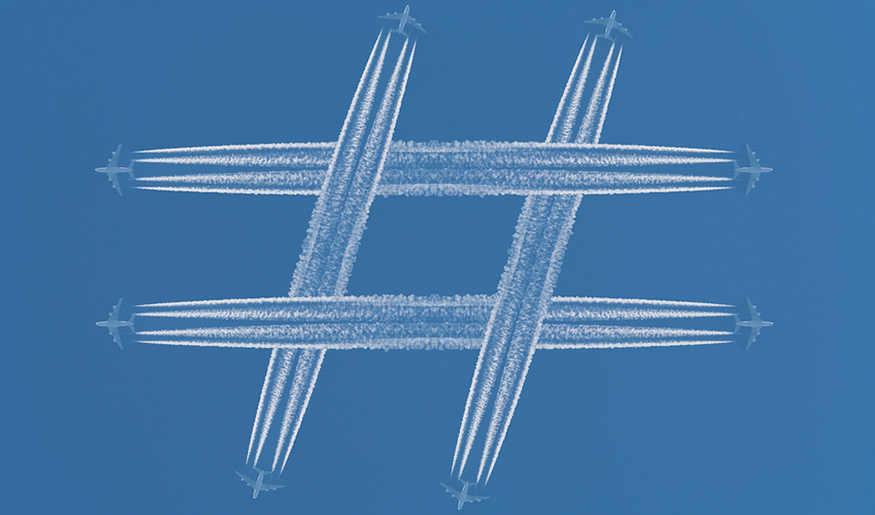 The contrails of planes crossing each other and making a polygon.