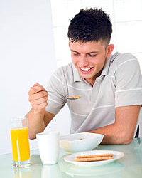 Teen eating breakfast