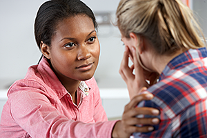 Teen speaking with an adult