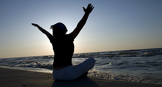 Woman sitting on the beach