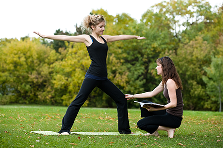 Two women exercising in the park