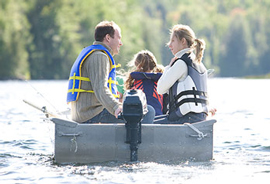 Family wearing lifevests on the water