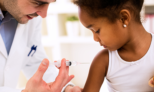 Young girl receiving vaccination