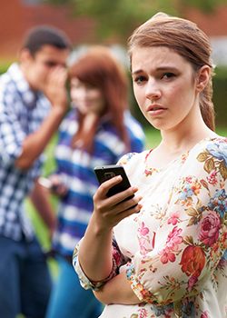 Upset teen with smart phone