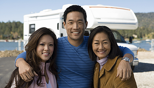 Happy family in front of an RV