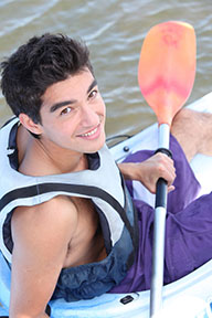 teenage male in a canoe