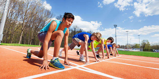 Teenagers about to race on a track