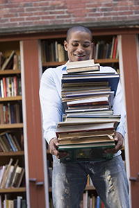 Teenager carrying textbooks