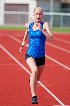 Teen running on track