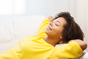 Teenager resting on couch