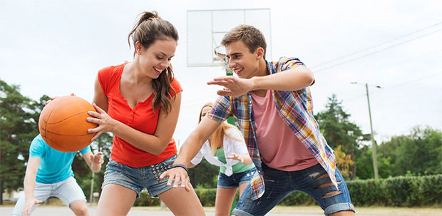 Teenagers playing basketball
