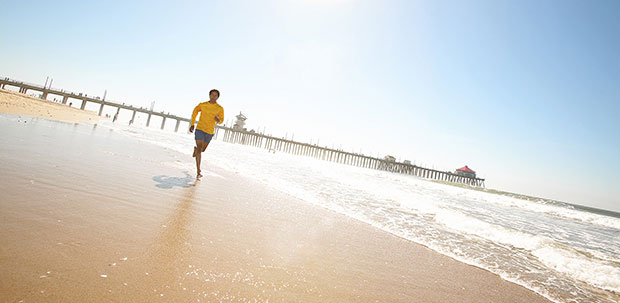 Teenager running on the beach