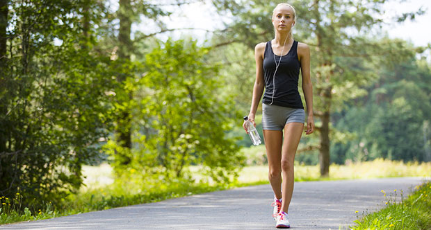 Teenager walking down country road