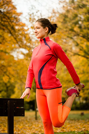 Girl strecthing before a run