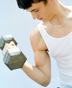 Teenager performing bicep curls