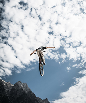 Teenager performing a dangerous bicycle stunt