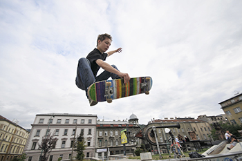 Teenager skateboarding without a helmet