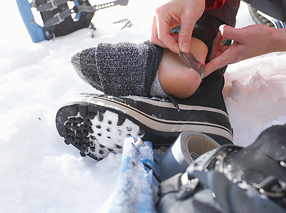 Applying a bandage to an injured heel