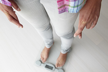 Girl standing on a scale