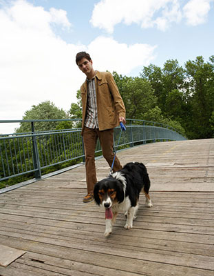 teen boy walking a dog