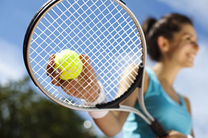 girl holding a tennis racket