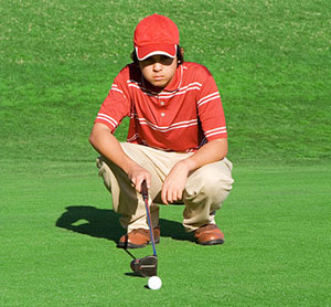 student golfing