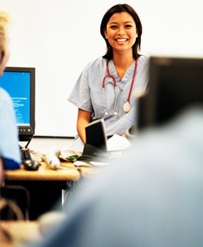 A young femal doctor in a classroom