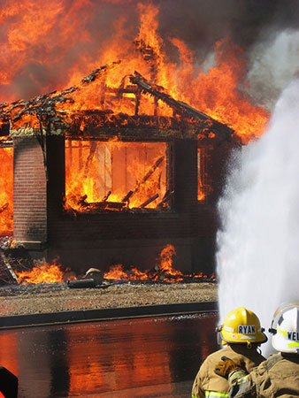 Firefighters fighting a house fire