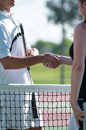 Tennis players shaking hands after a match