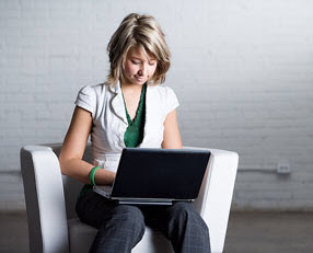 Teenage girl at computer