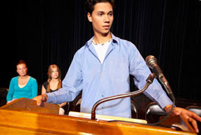 teen at podium during debate