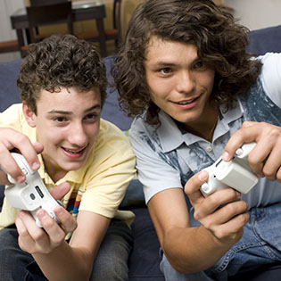 two male teens playing a videogame