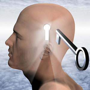 Male with keyhole in head with key in foreground to unlock mind